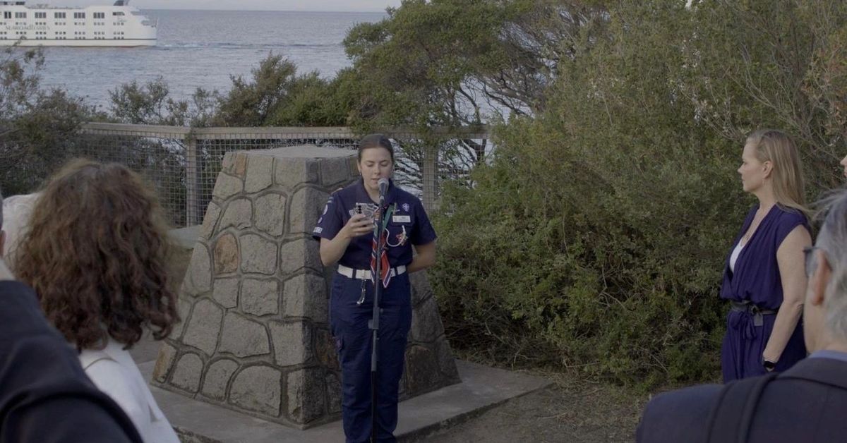 ANZAC Day ceremony at a coastal memorial overlooking the water